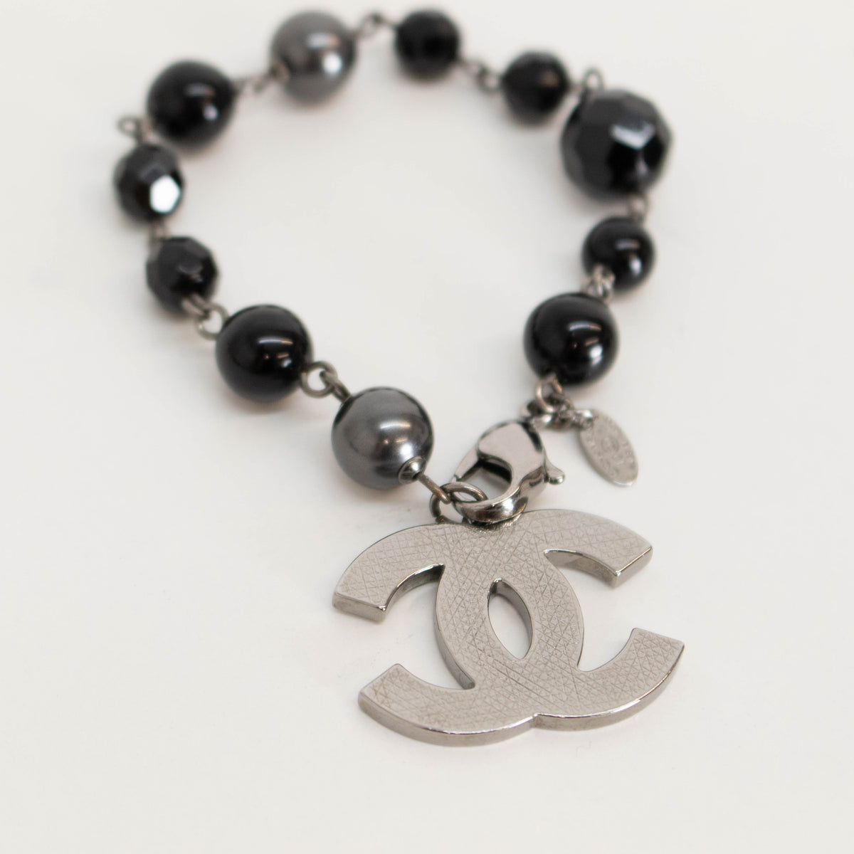 Chanel Black Faux Pearl Silver Tone CC Bracelet