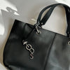 Tod's Black Pebble Leather Tote with Silver Pendant