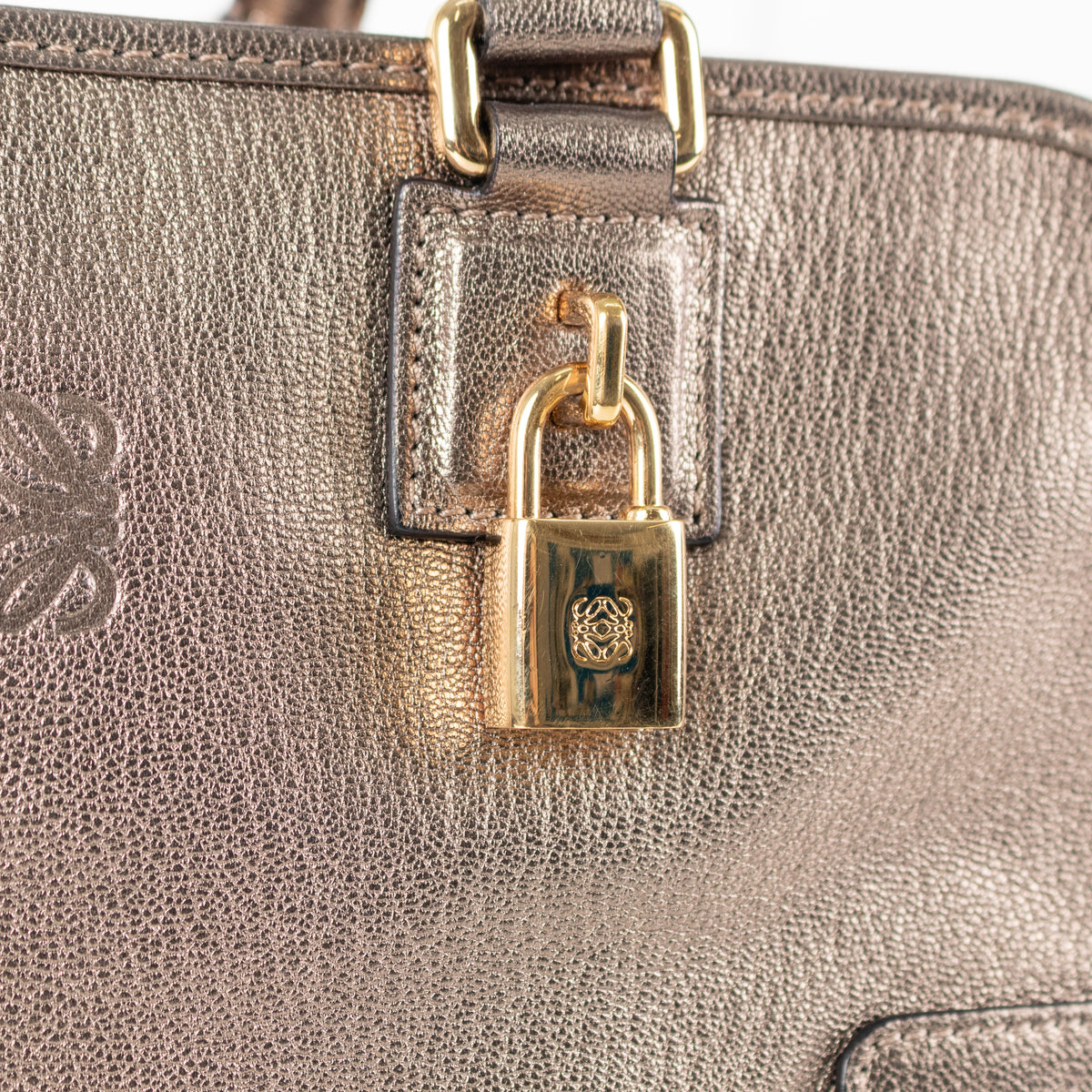 Close up of gold padlock Loewe Gold Tone Amazona Bag