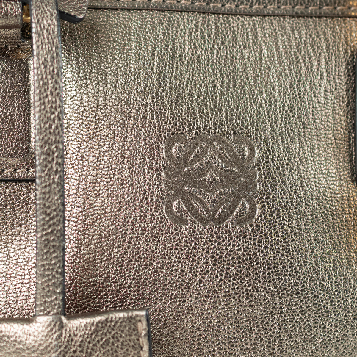 Close up of logo on preloved Loewe Gold Tone Amazona Bag