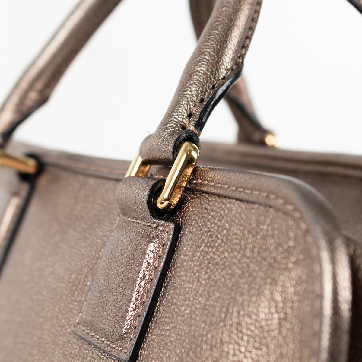 Close up of gold hardware on Loewe Gold Tone Amazona Bag