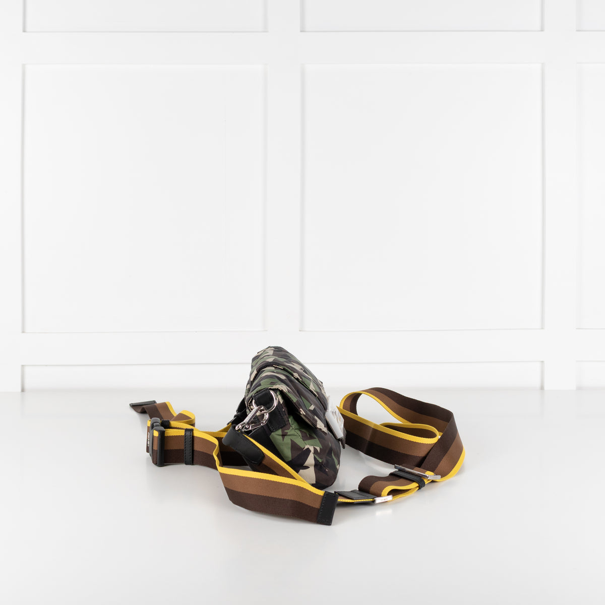 Side image of preloved Fendi bag and straps on show on white background.