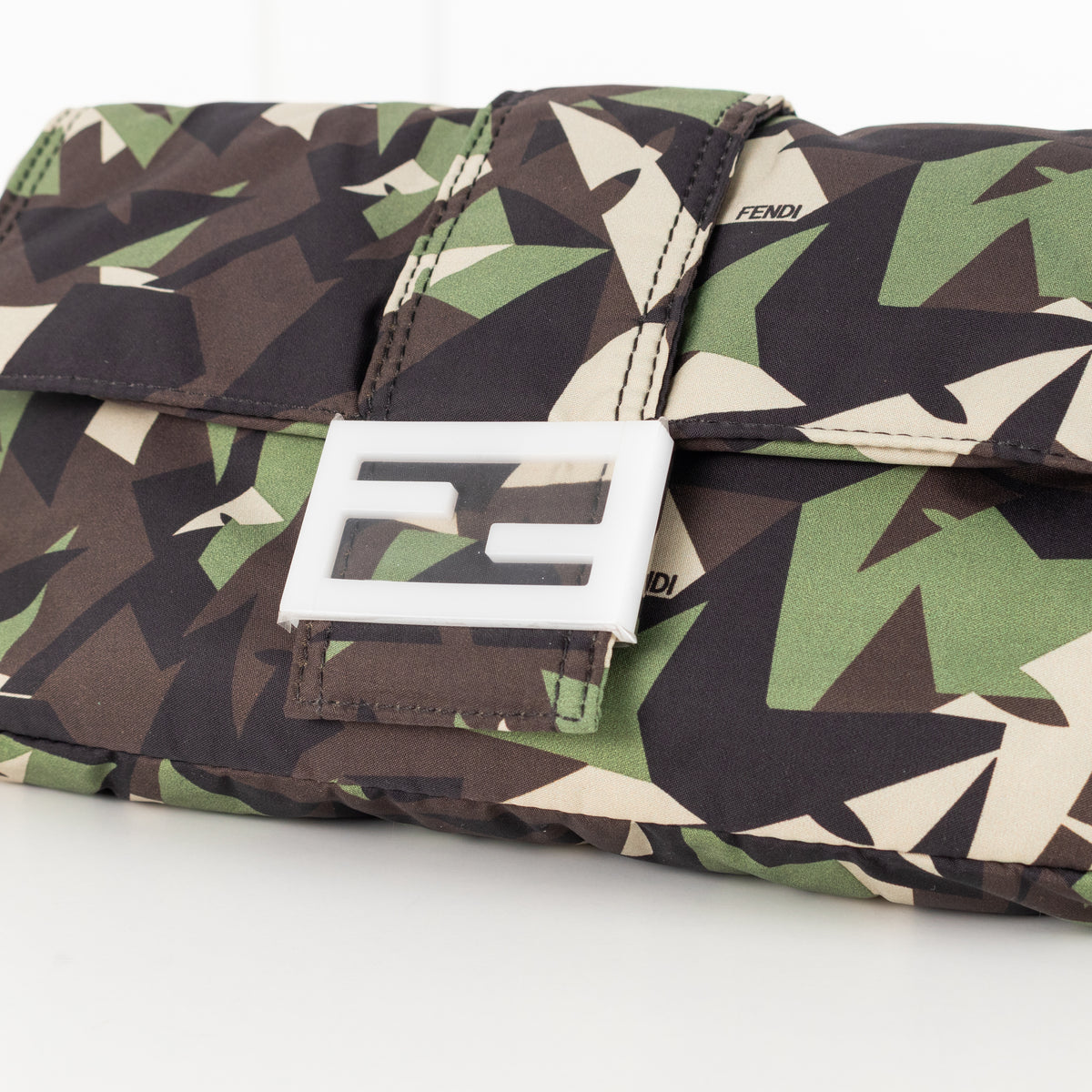Close up of hardware on the Fendi Green Nylon Camouflage Convertible Baguette Satchel bag.