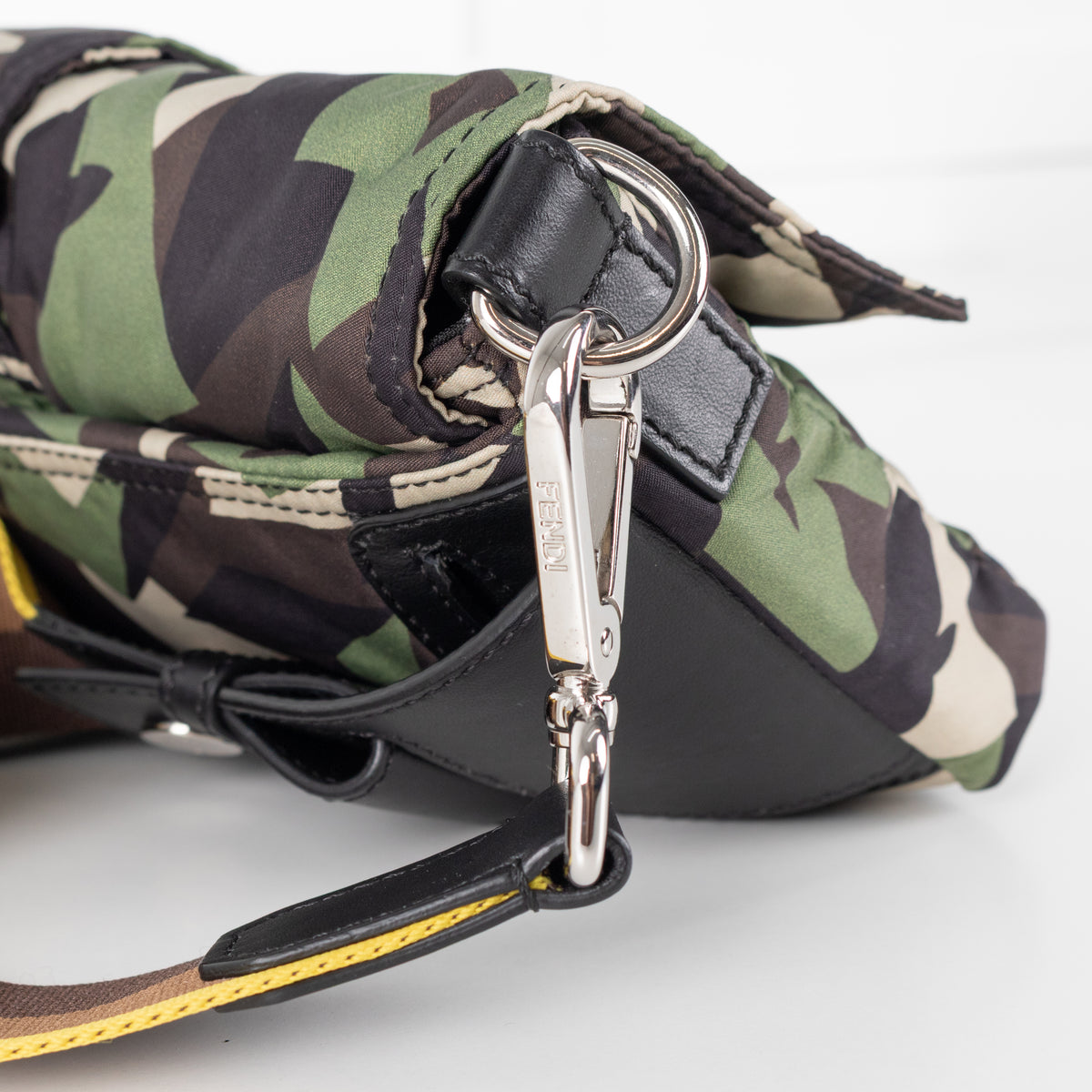 Close up of silver hardware clasp on Fendi Green Nylon Camouflage Convertible Baguette Satchel bag.