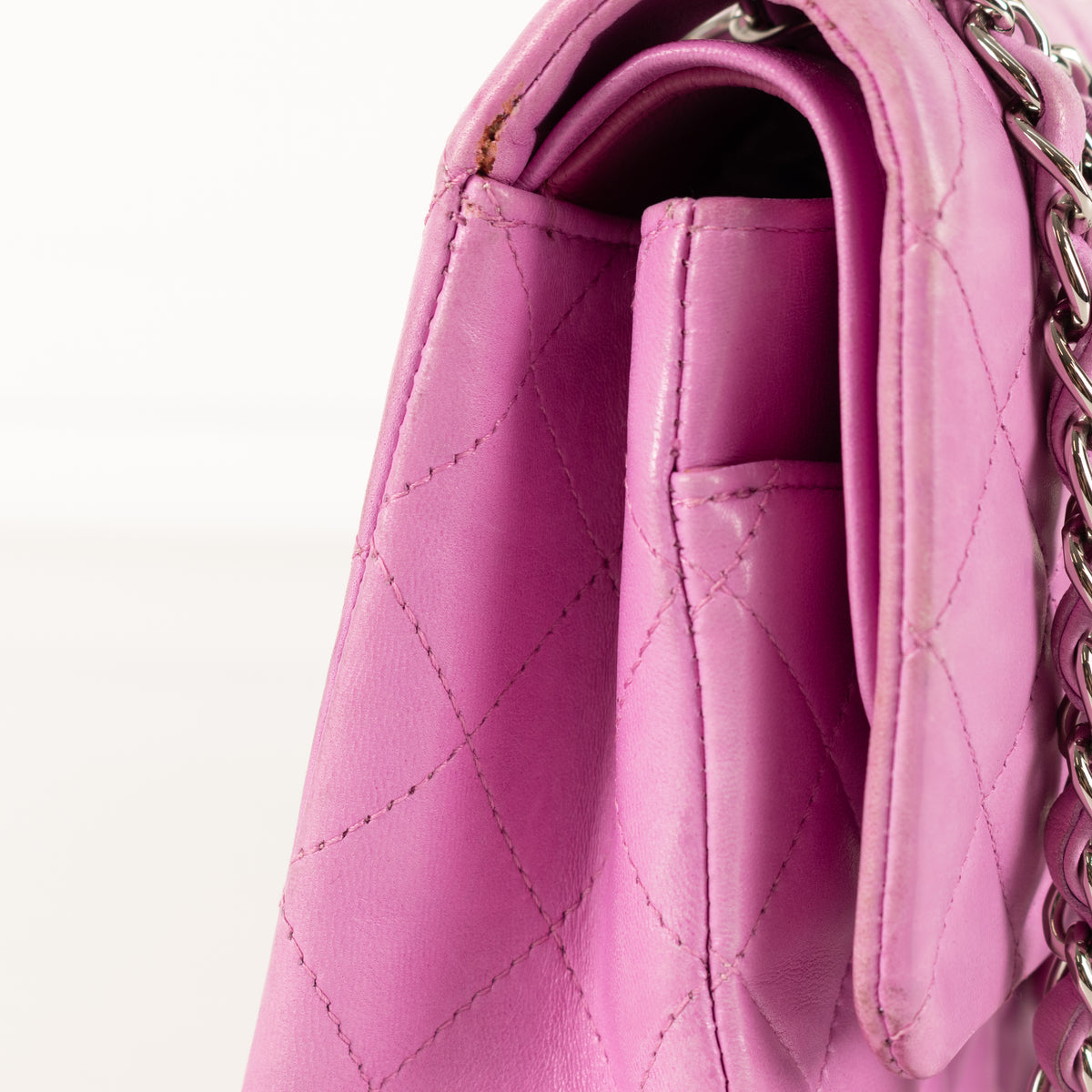 Close up of side of Chanel Pink Matelasse 25 Lambskin Double Flap Bag.