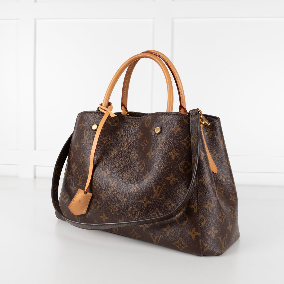 Close up of Louis Vuitton Monogram Canvas Montaigne MM bag.