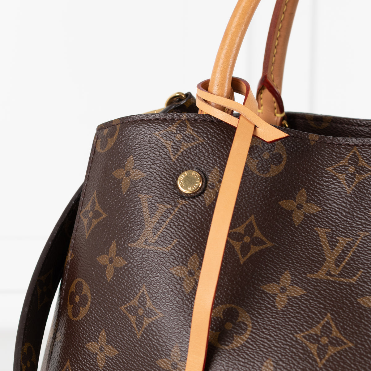 Close up of Louis Vuitton Monogram Canvas Montaigne MM bag.