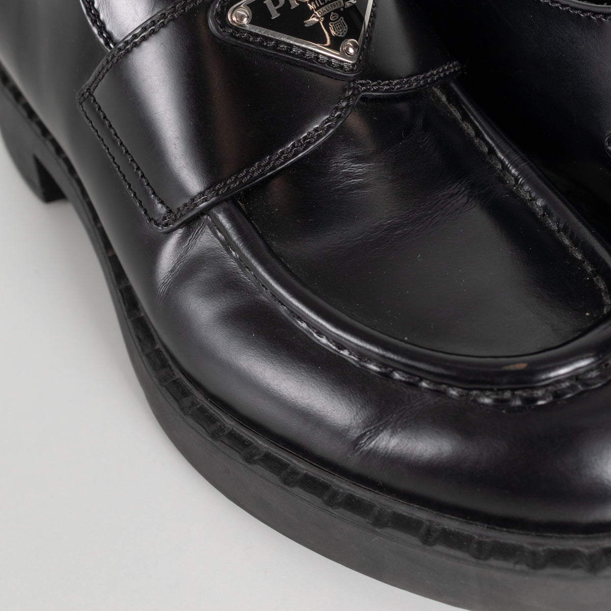 Prada Black Leather Plaque Logo Platform Loafers