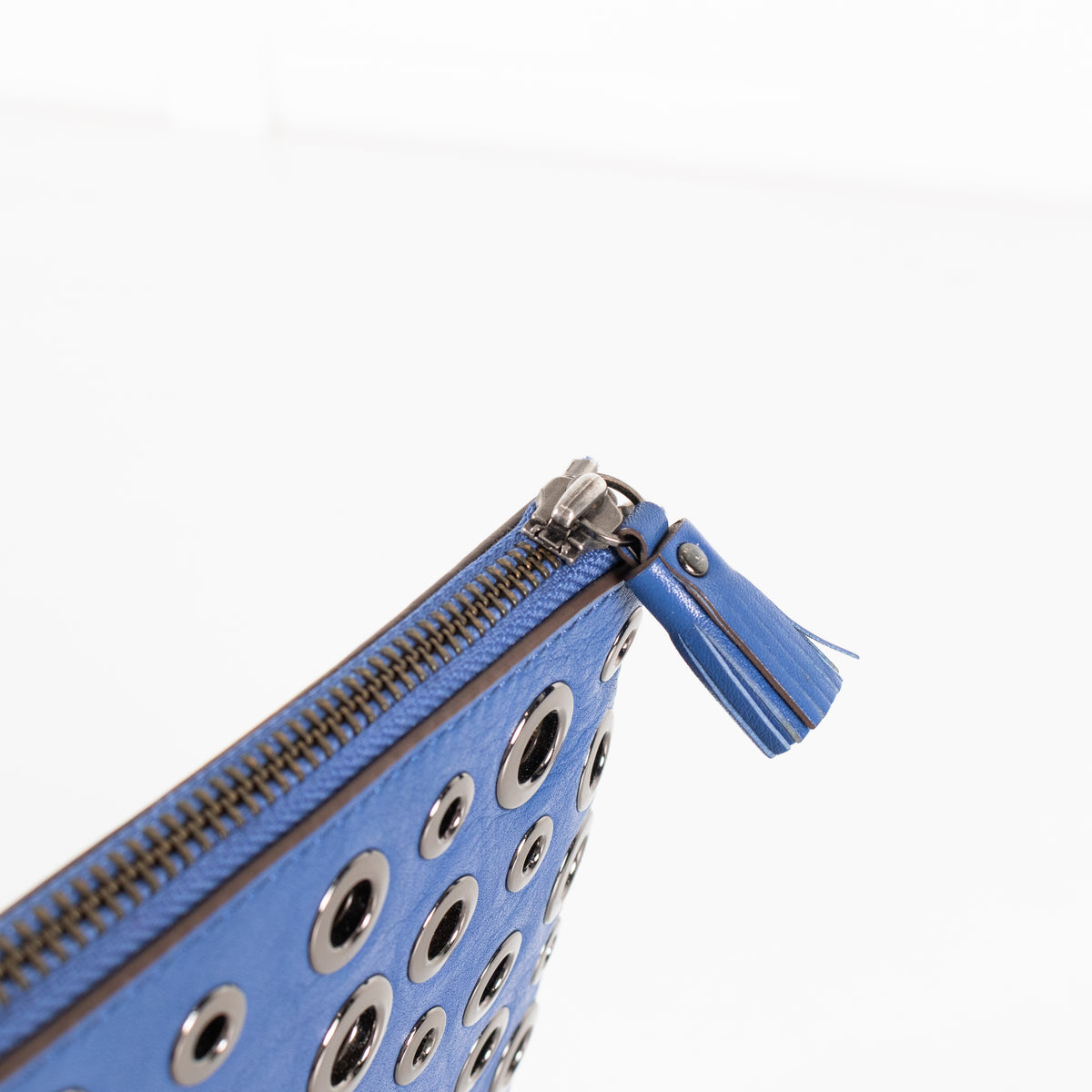 Anya Hindmarch Bright Blue Clutch with Gunmetal Eyelet Detailing