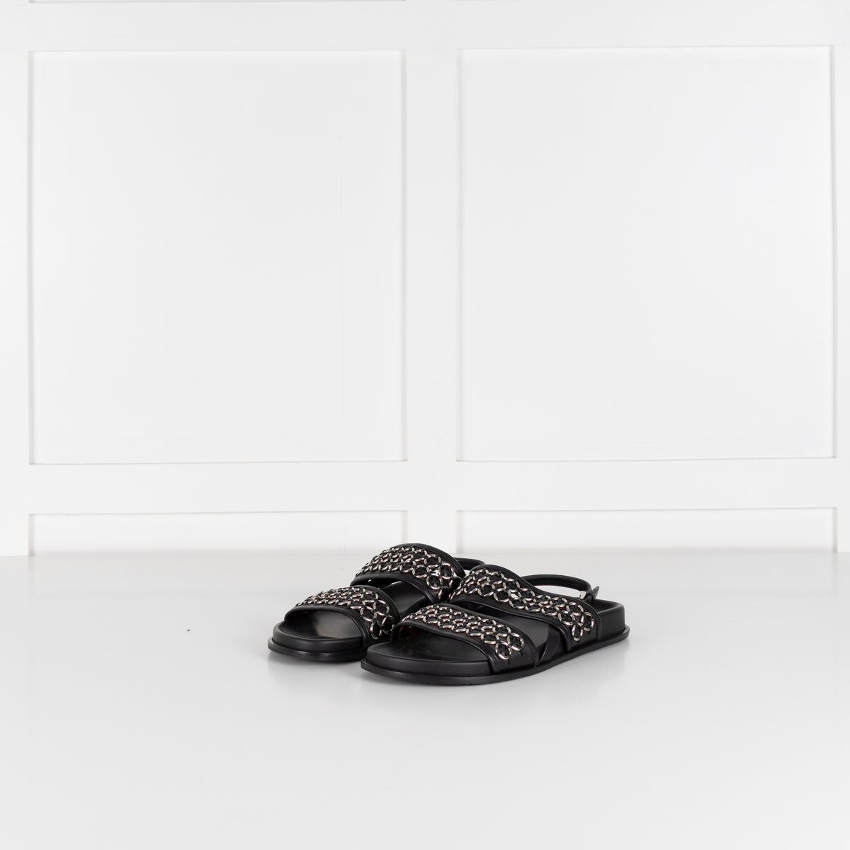 Alaia Black Leather Silver Eyelet Slingback Flat Sandals
