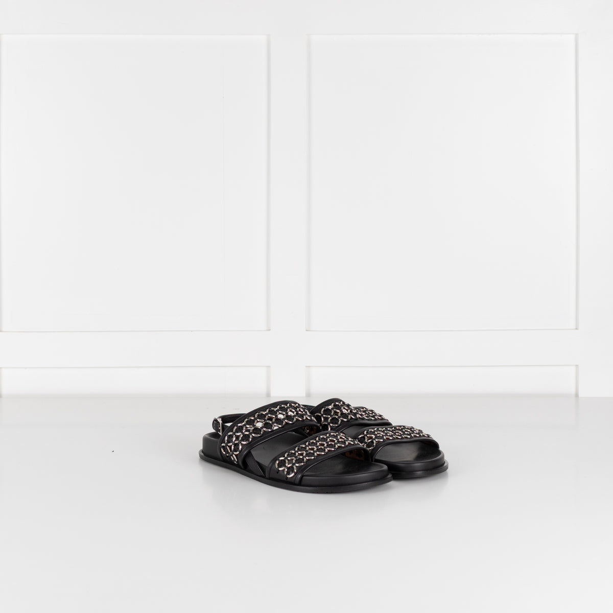 Alaia Black Leather Silver Eyelet Slingback Flat Sandals