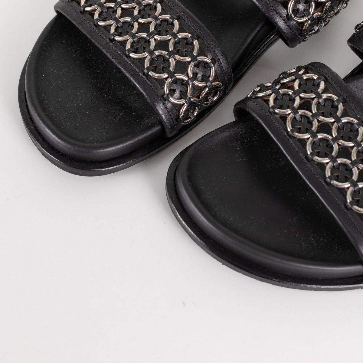 Alaia Black Leather Silver Eyelet Slingback Flat Sandals