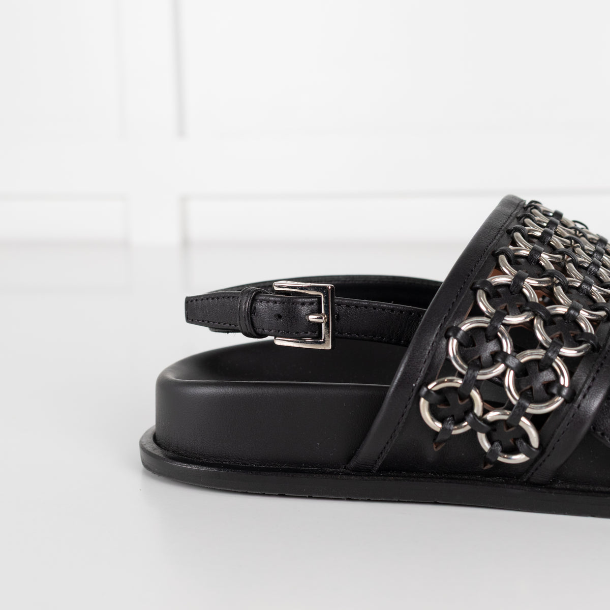 Alaia Black Leather Silver Eyelet Slingback Flat Sandals