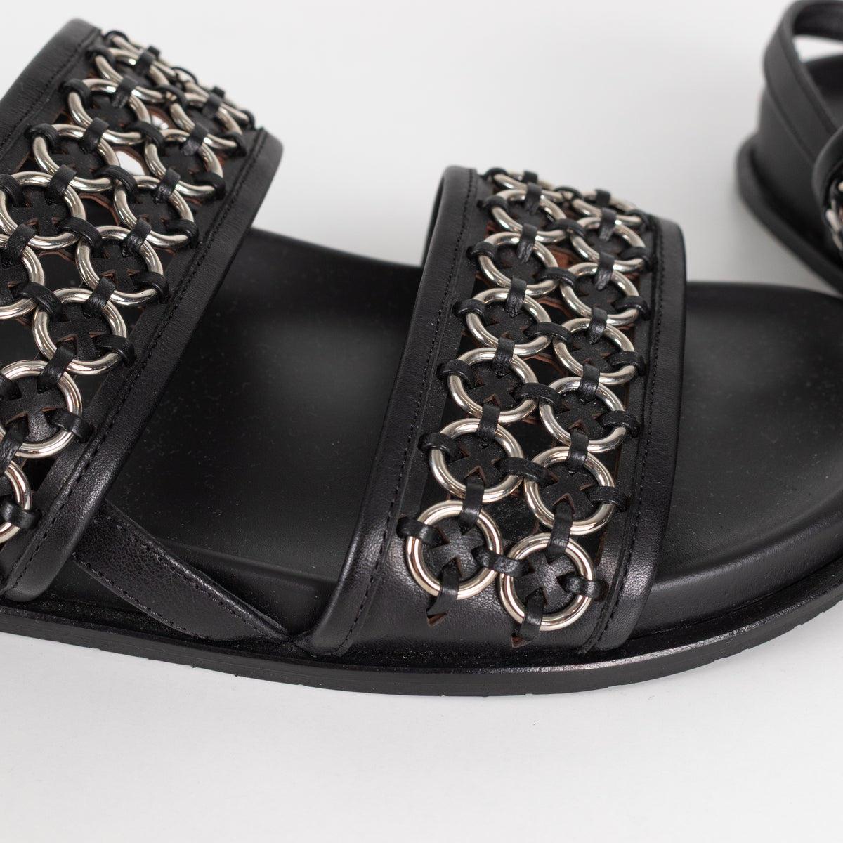 Alaia Black Leather Silver Eyelet Slingback Flat Sandals