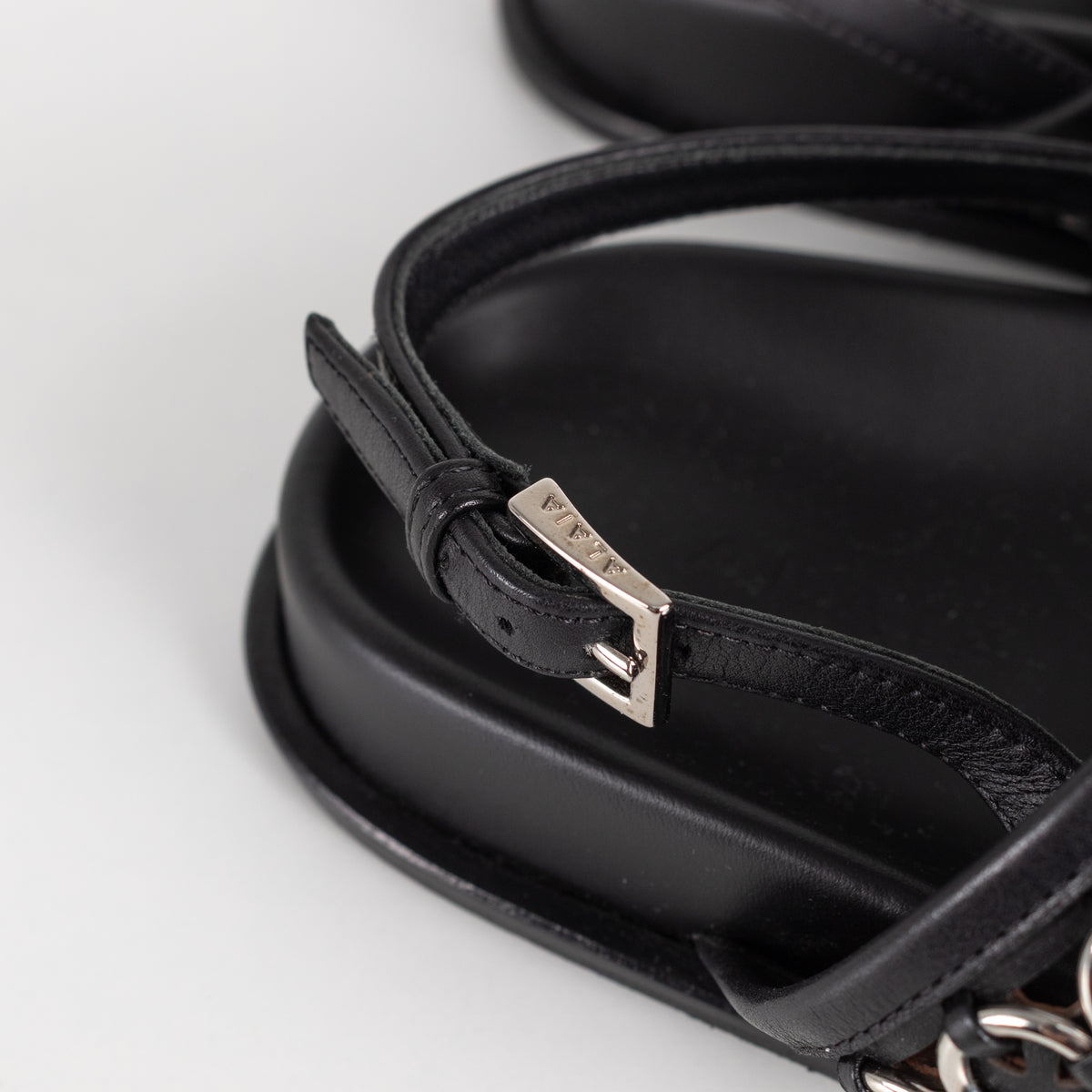 Alaia Black Leather Silver Eyelet Slingback Flat Sandals
