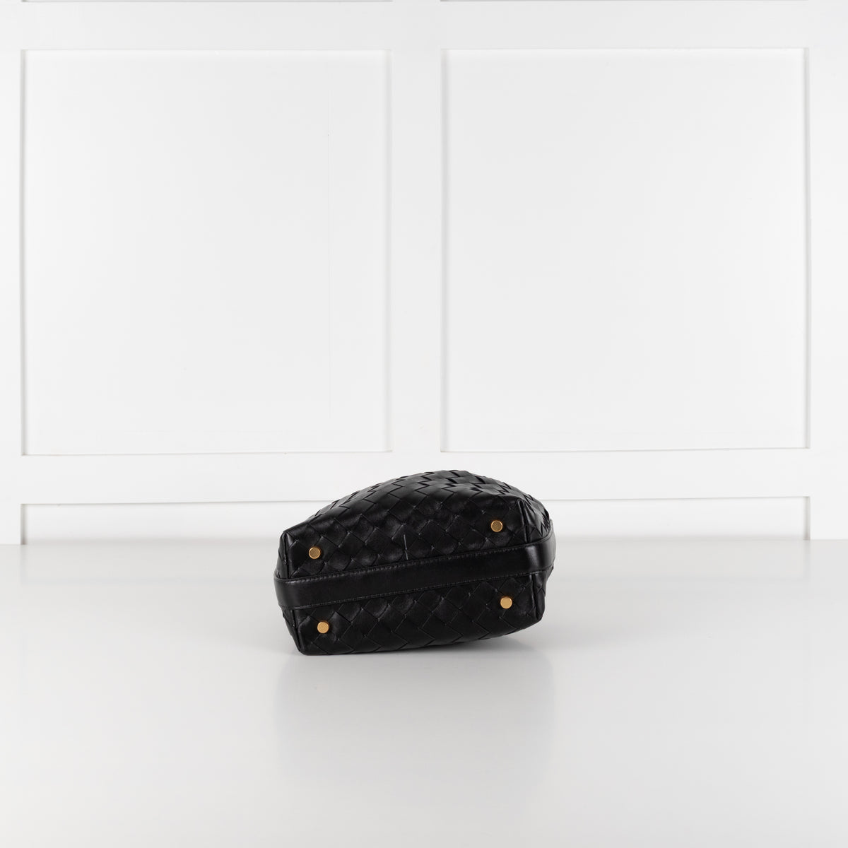 Base of the preloved Black Bottega Veneta mini Wallace bag in intrecciato leather in the phoenix style studio.