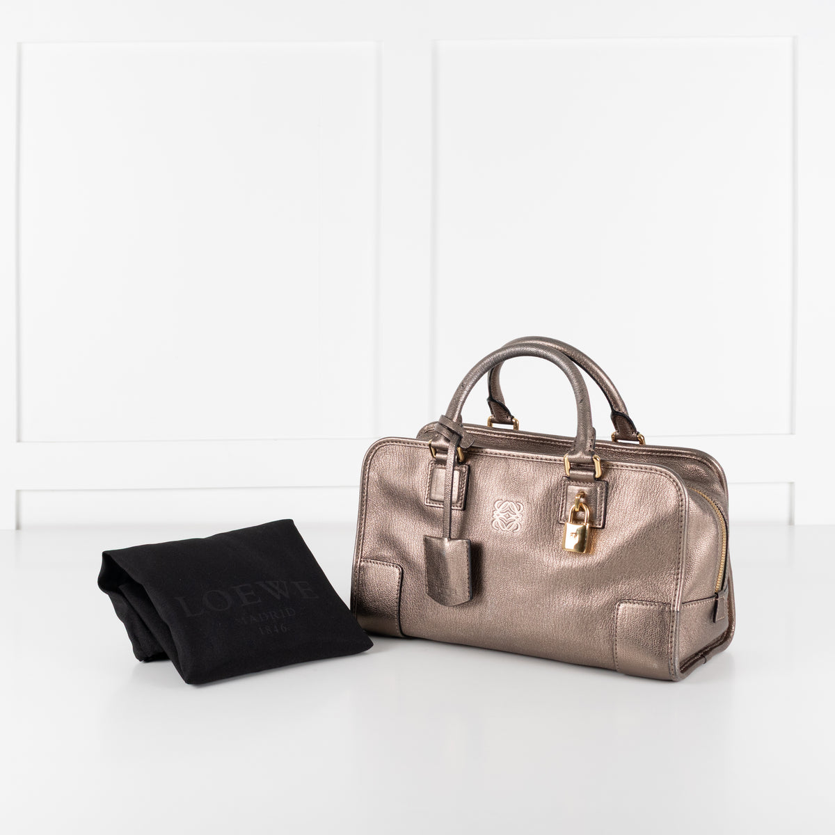 Loewe Gold Tone Amazona Bag with original dust bag on white background.