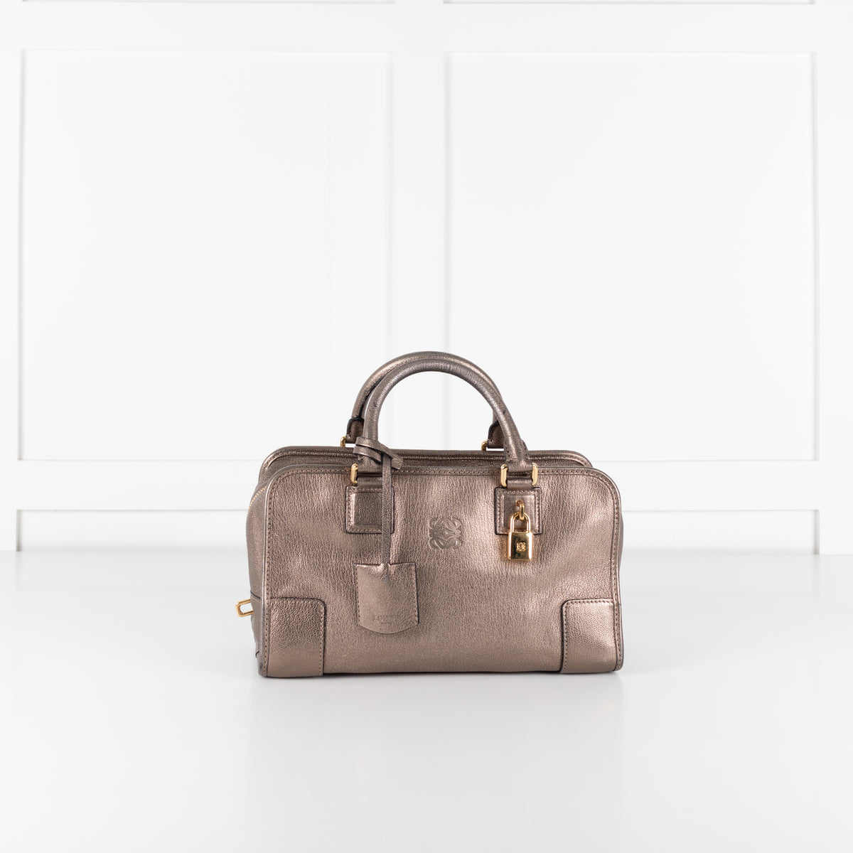 Loewe Gold Tone Amazona Bag on white background. 