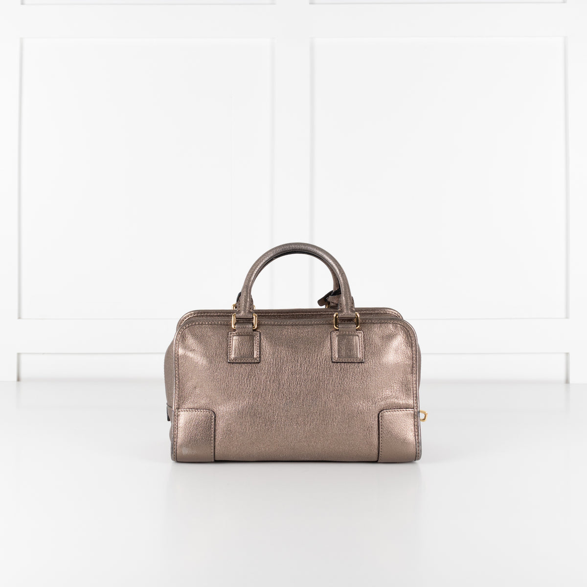 Close up of preloved Loewe Gold Tone Amazona Bag on white background. 