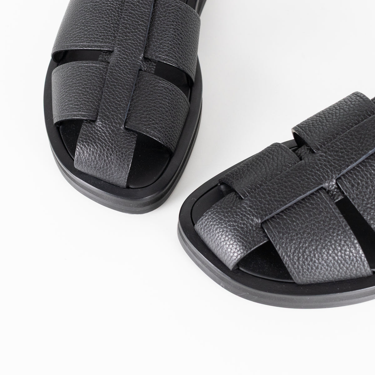 The Row Black Grain Leather Fisherman Flat Sandal