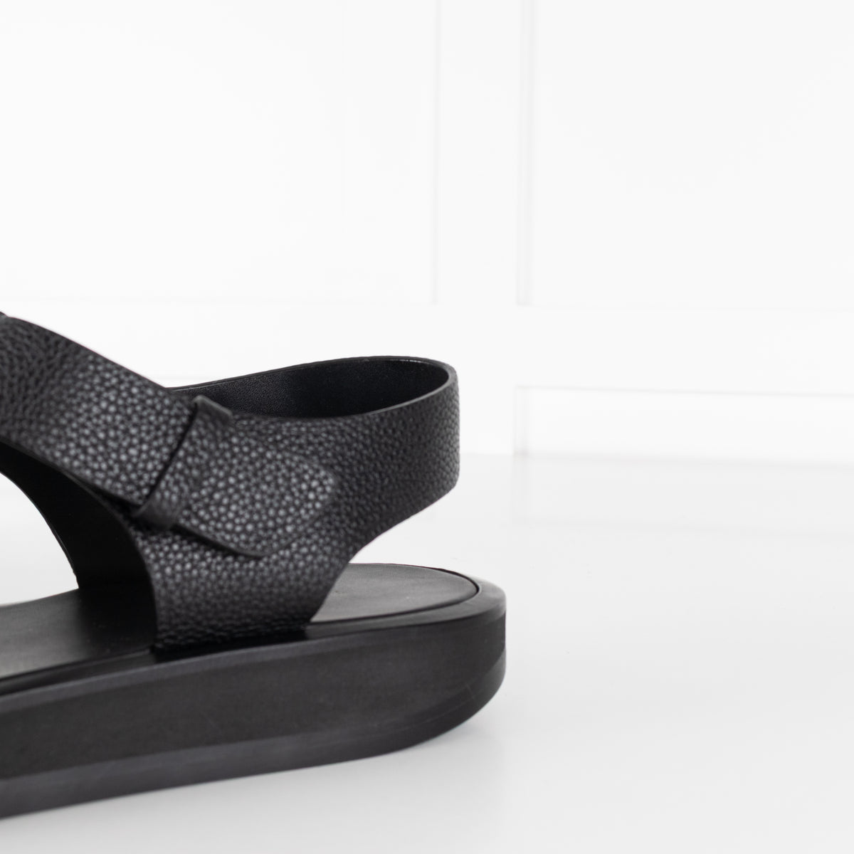 The Row Black Grain Leather Fisherman Flat Sandal