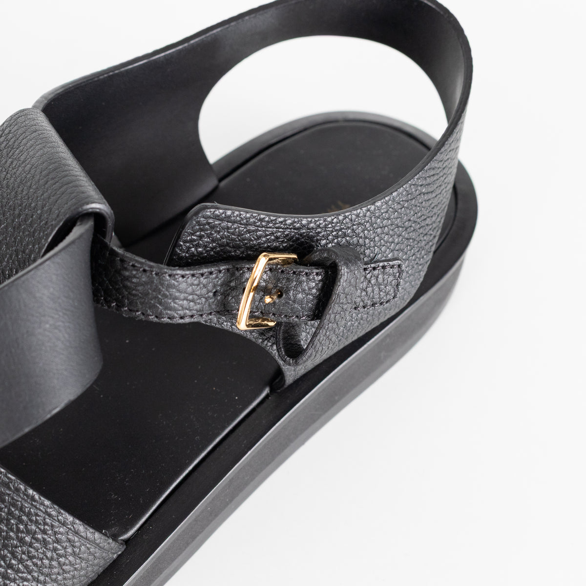 The Row Black Grain Leather Fisherman Flat Sandal