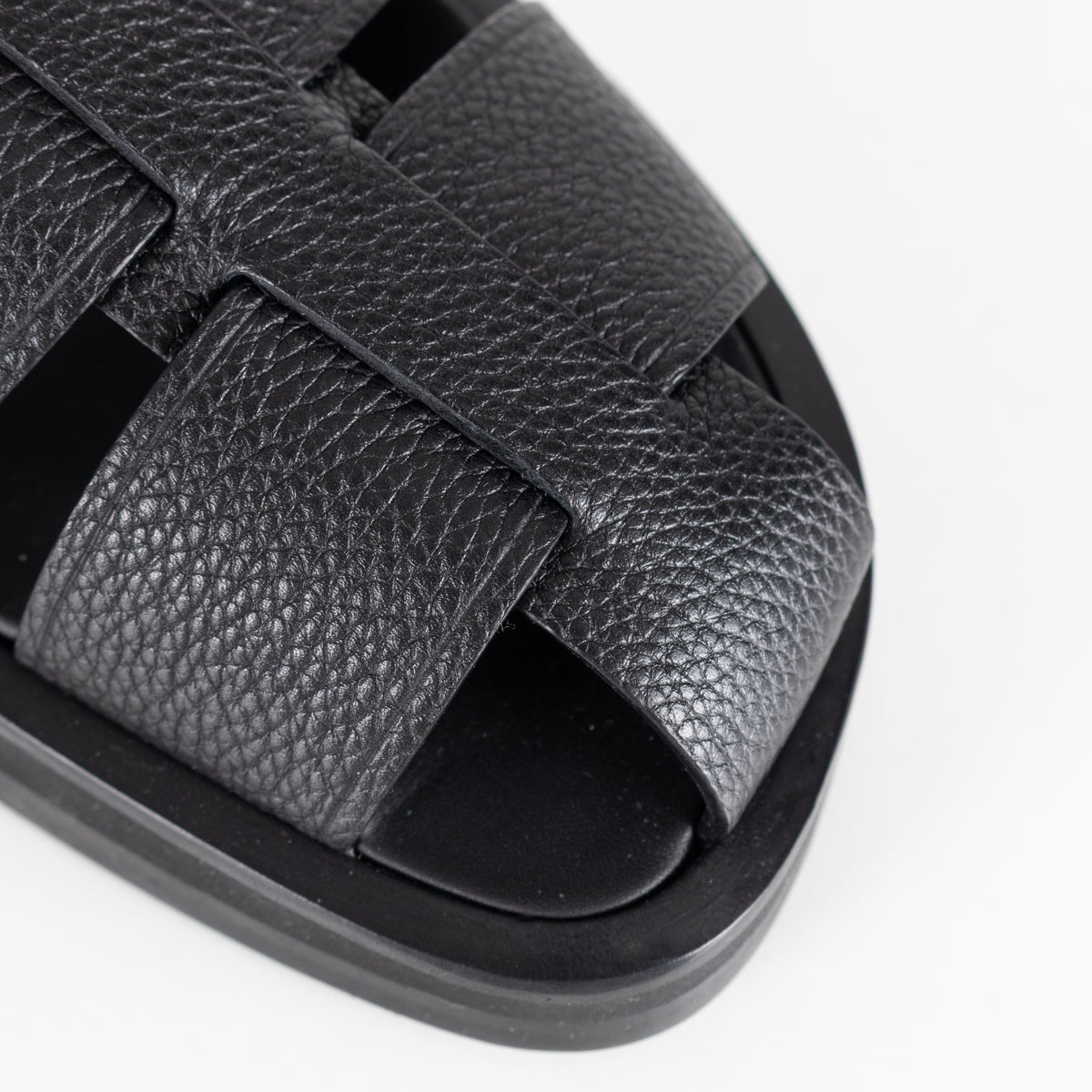 The Row Black Grain Leather Fisherman Flat Sandal