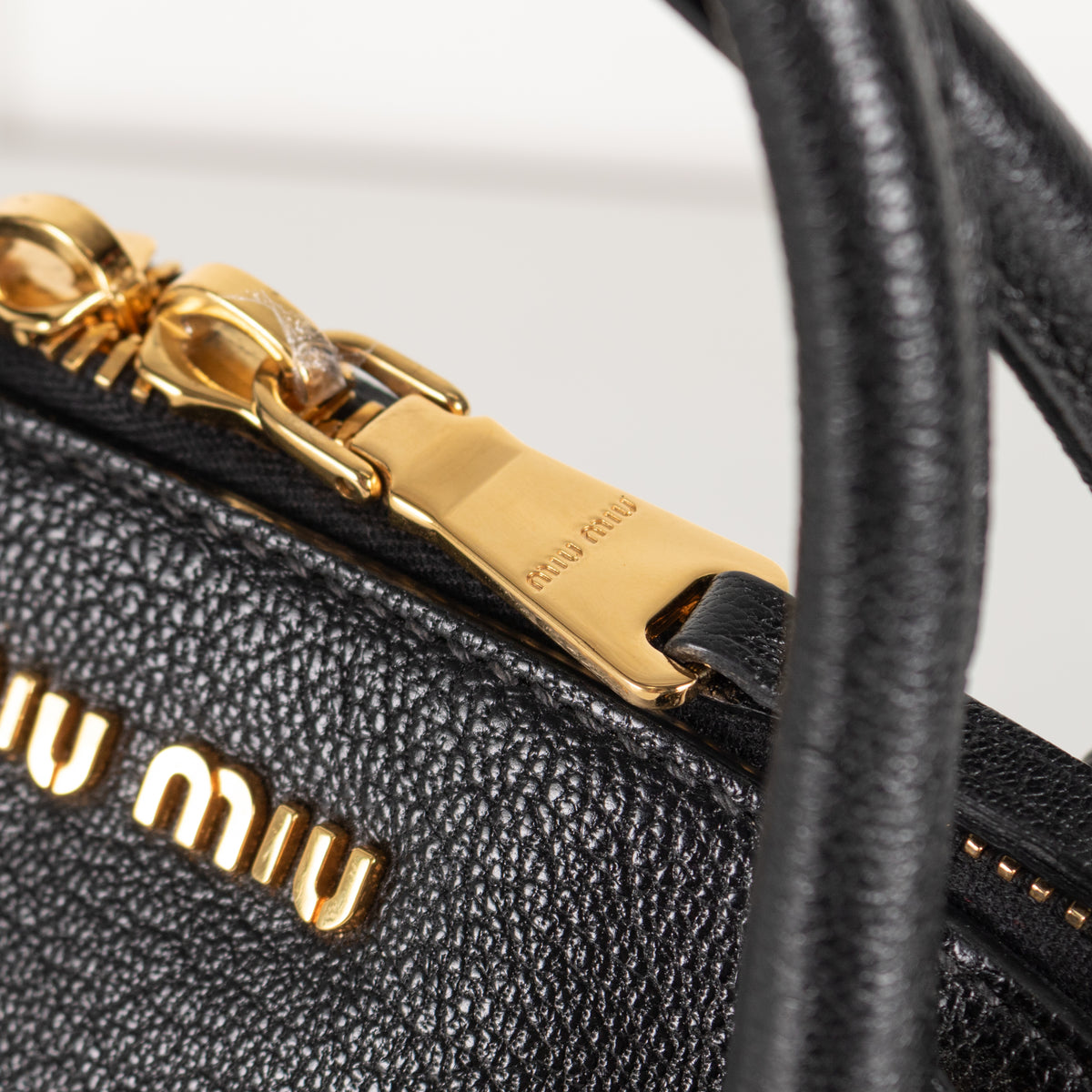 Miu Miu black grained Madras leather dome bag