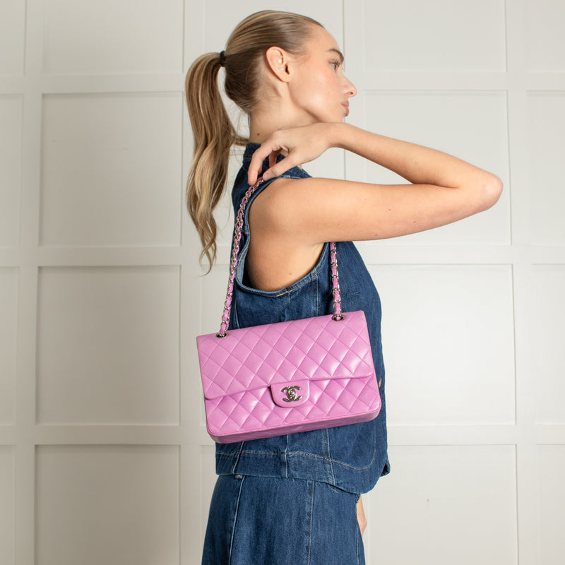 model holding Chanel Pink Matelasse 25 Lambskin Double Flap Bag.