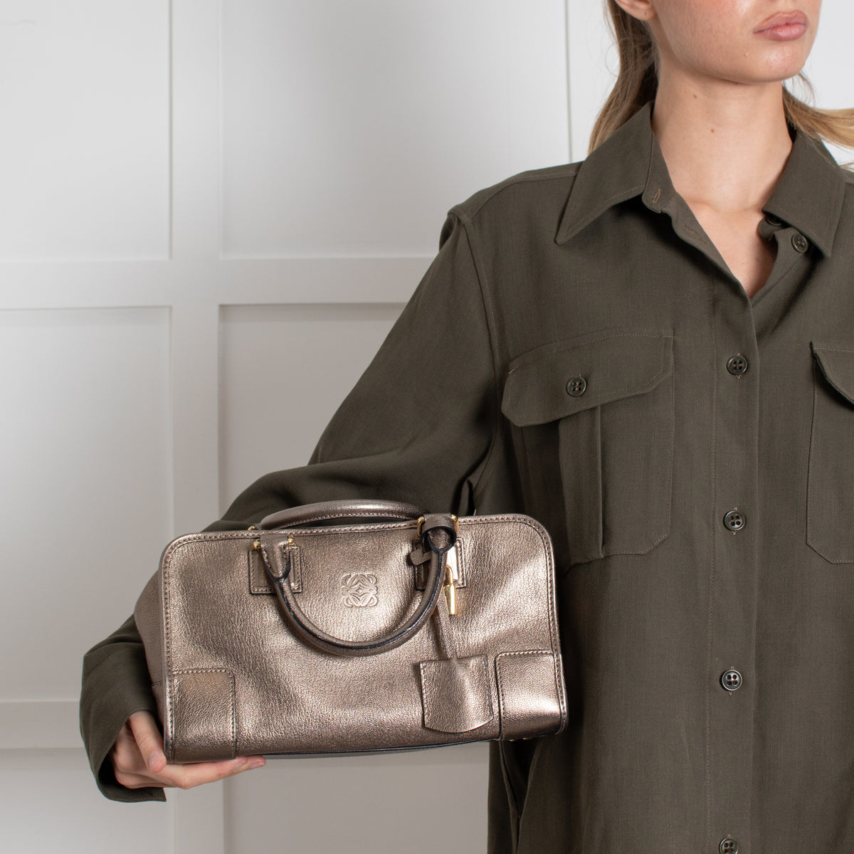 Model holding Loewe Gold Tone Amazona Bag
