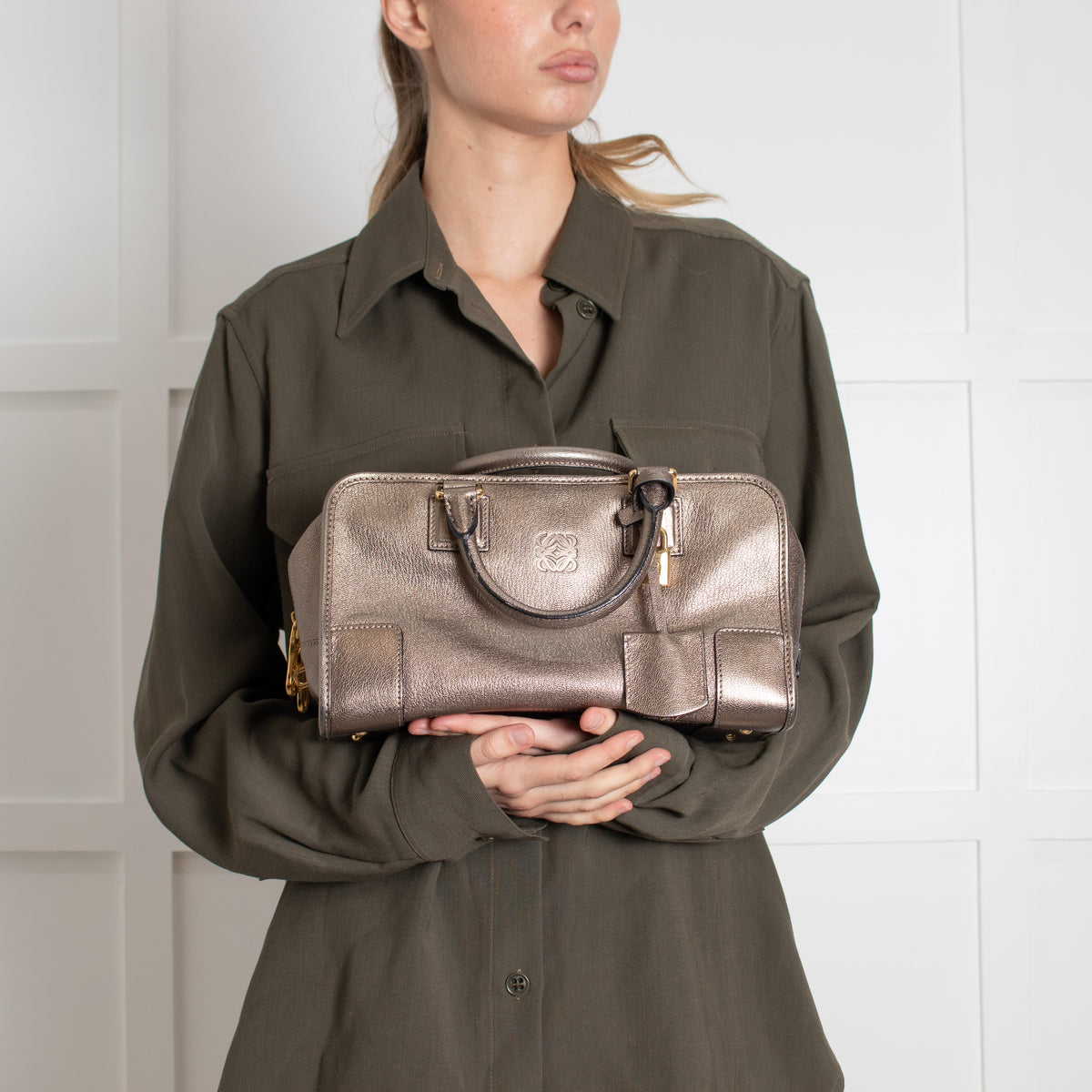 Model holding Loewe Gold Tone Amazona Bag preloved. 