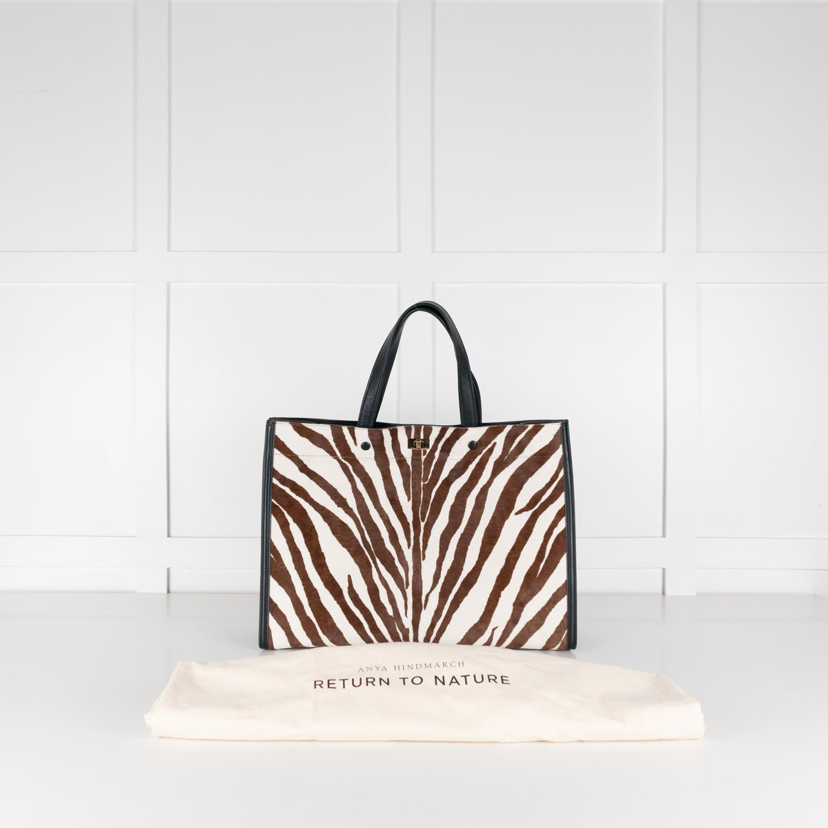Anya Hindmarch Zebra print Large Tote handbag with white background. 