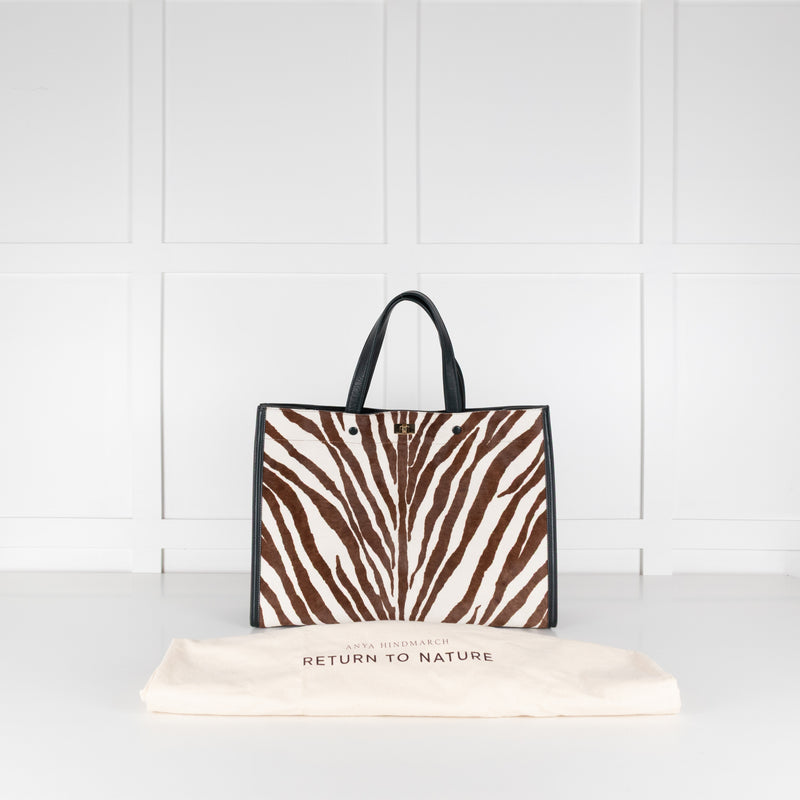 Anya Hindmarch Zebra print Large Tote handbag with white background. 