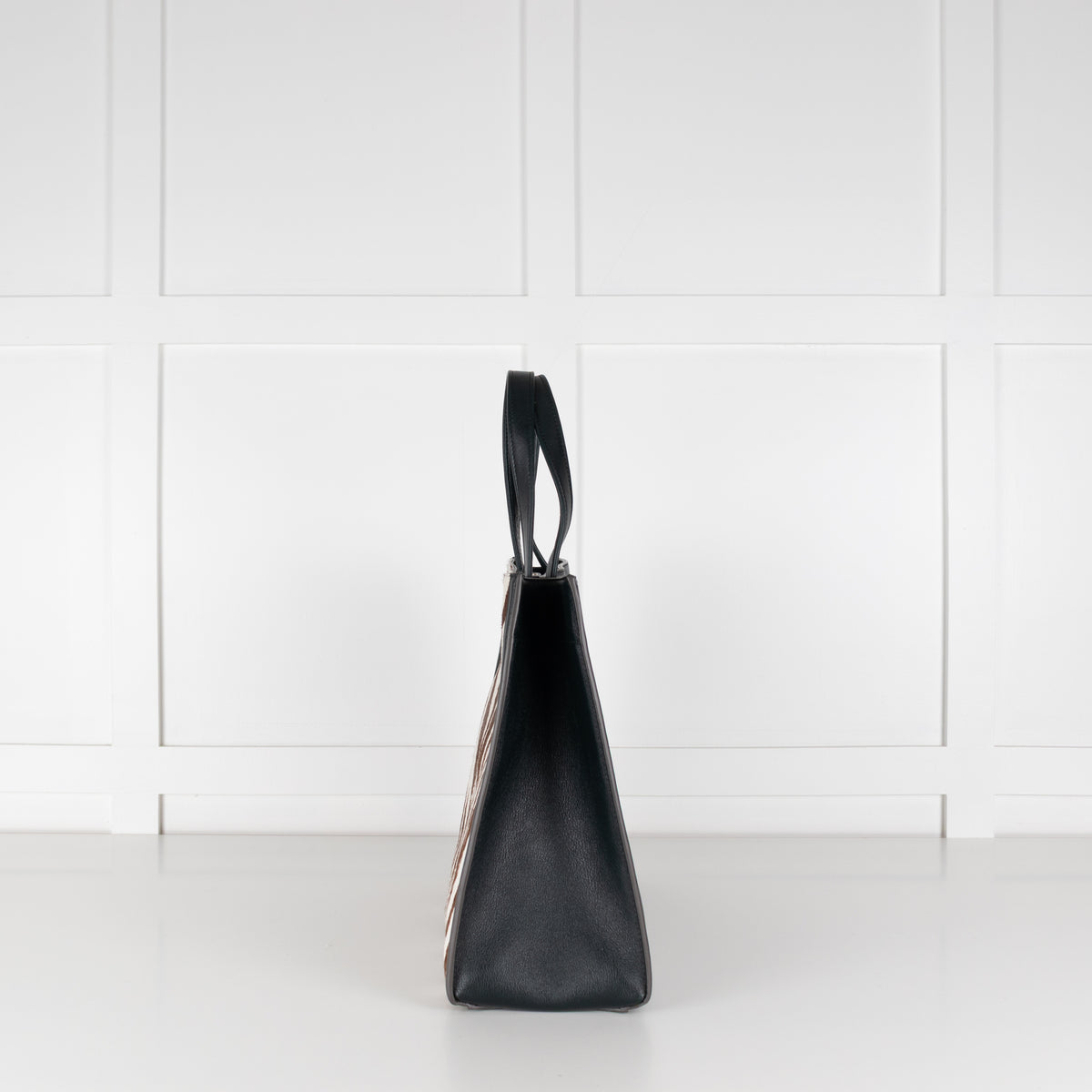 Side profile of Anya Hindmarch Zebra print Large Tote handbag.