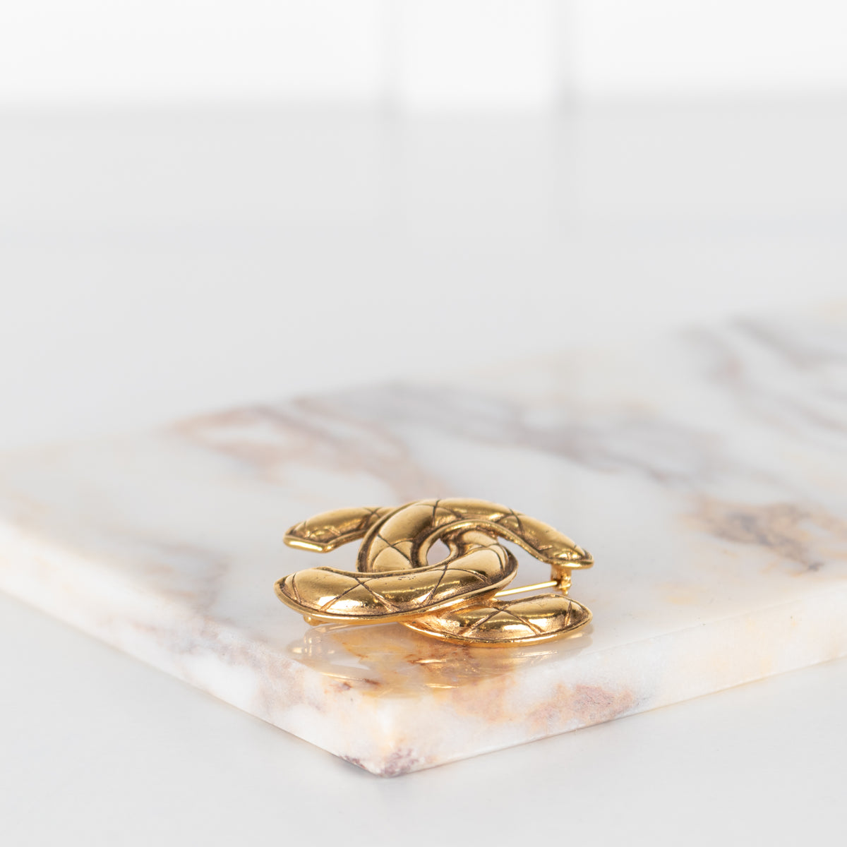 Chanel Gold Tone Quilted Brooch