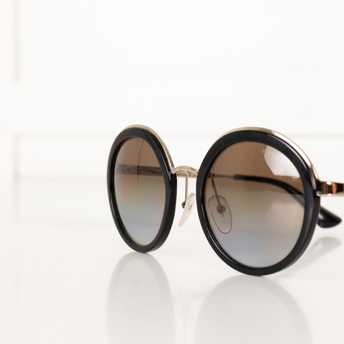 Prada Black & Gold Round Frame Sunglasses