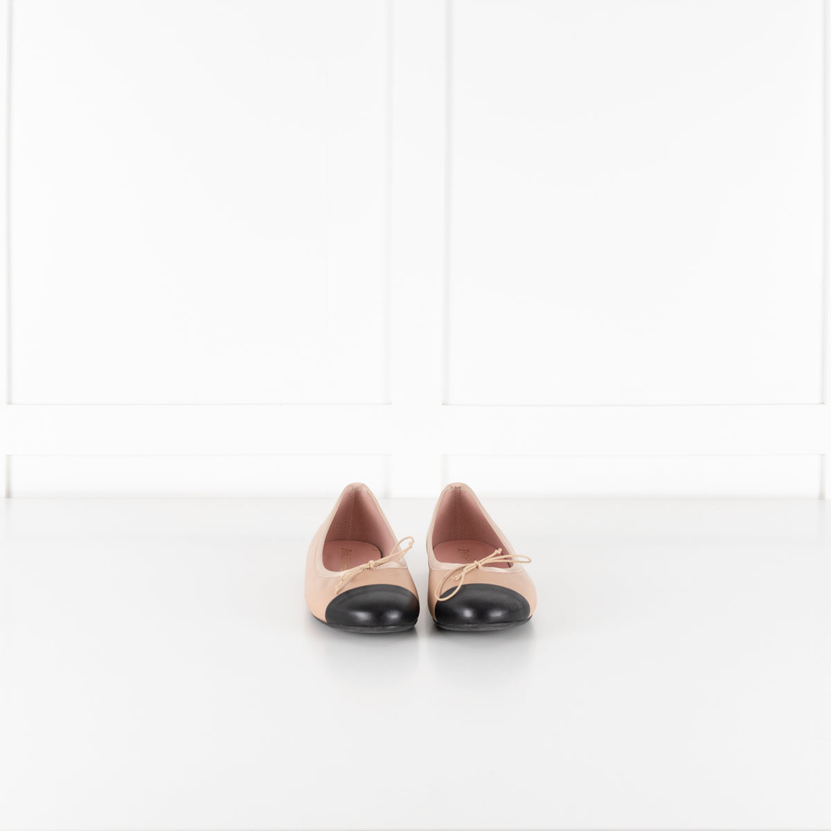 Pretty Ballerinas Nude Ballet Flats With Black Cap-Toe And Bow Detail