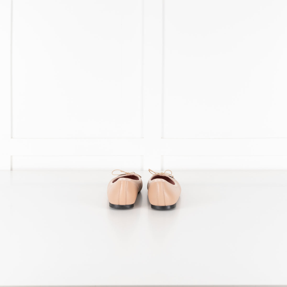 Pretty Ballerinas Nude Ballet Flats With Black Cap-Toe And Bow Detail