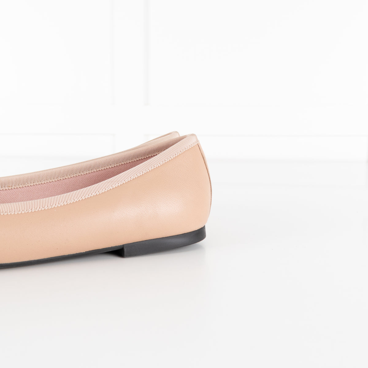 Pretty Ballerinas Nude Ballet Flats With Black Cap-Toe And Bow Detail