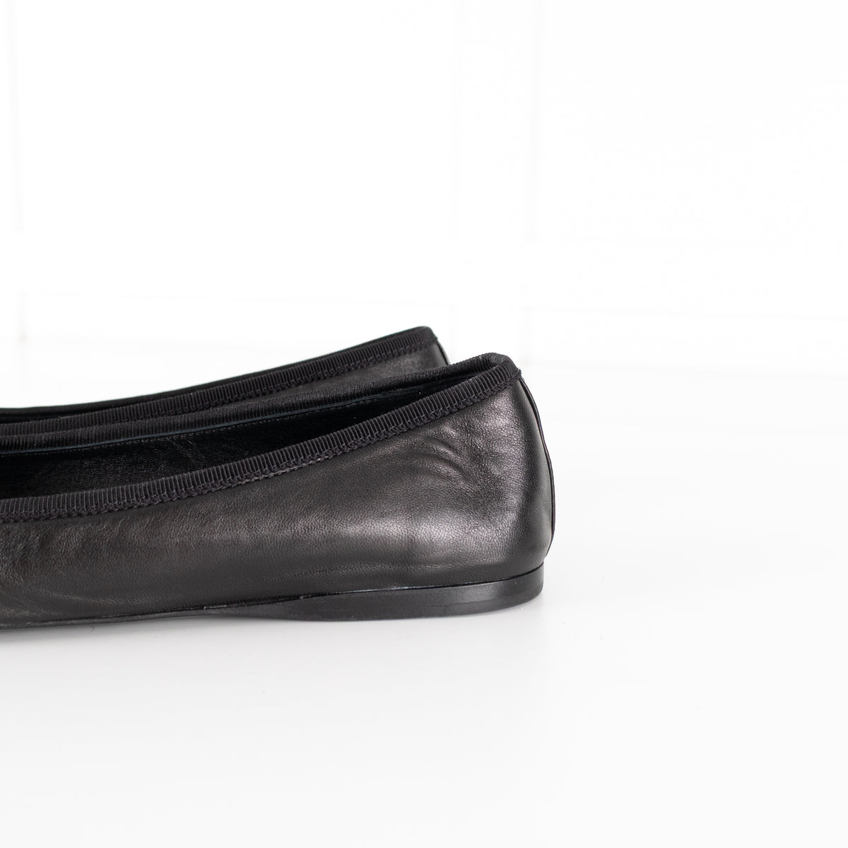 Prada Black Leather Ballet Flats With Bow And Logo Plaque