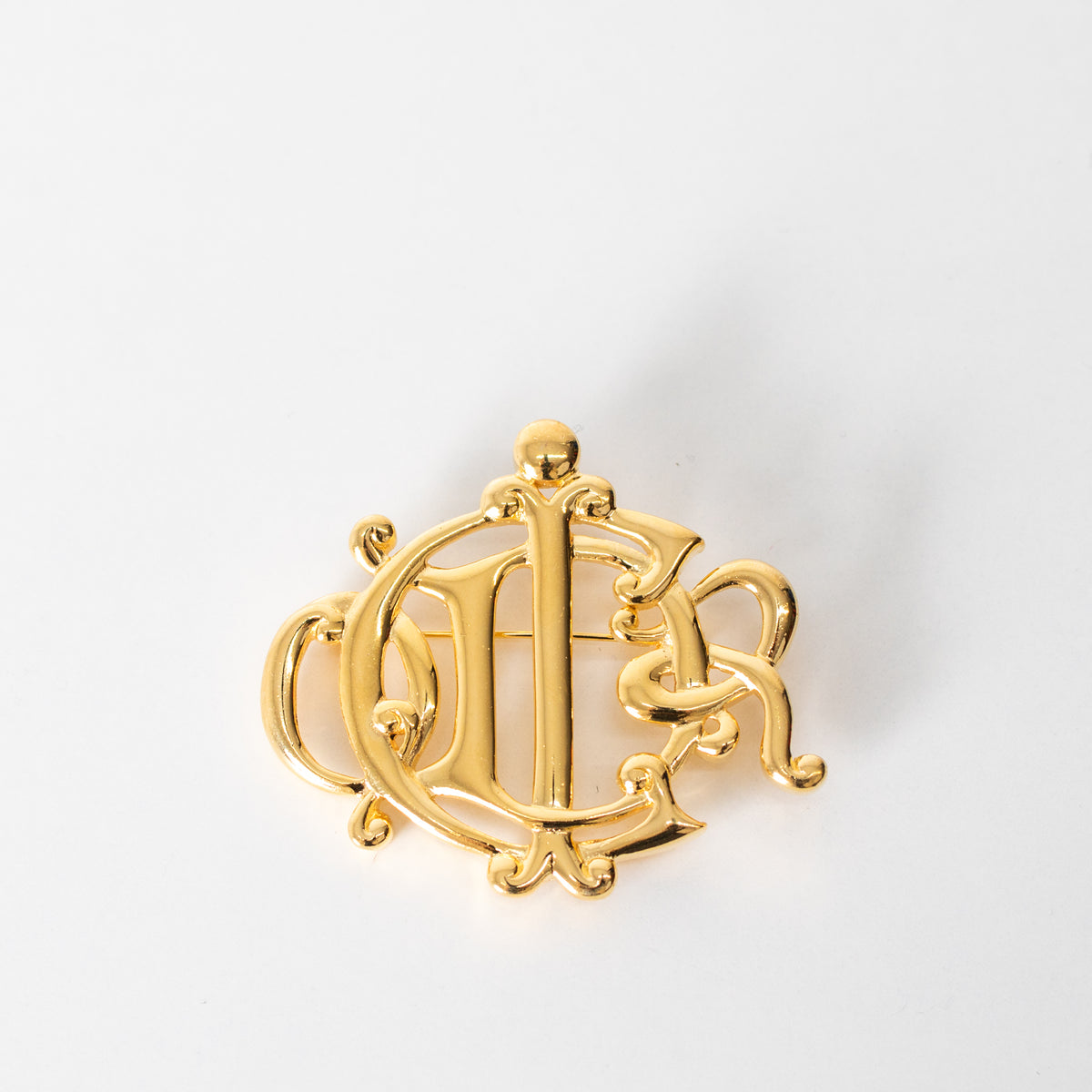 Christian Dior Gold Tone Monogram Brooch