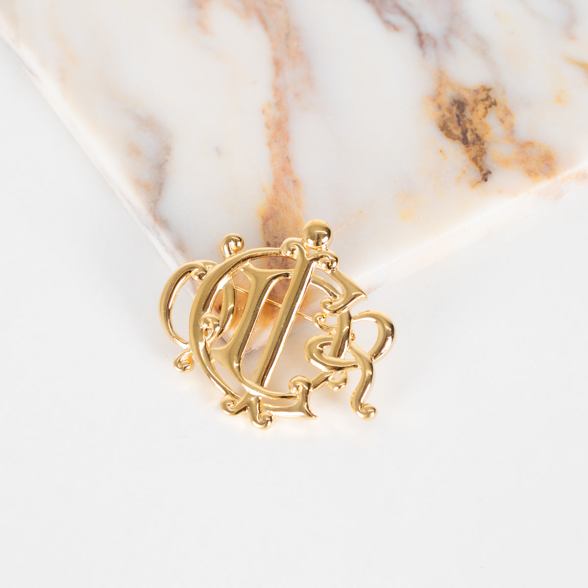 Christian Dior Gold Tone Monogram Brooch