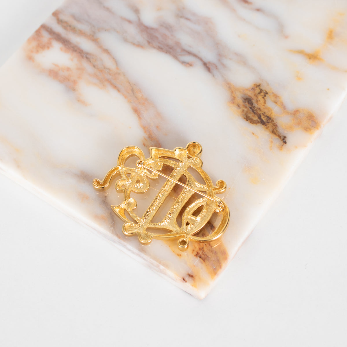 Christian Dior Gold Tone Monogram Brooch