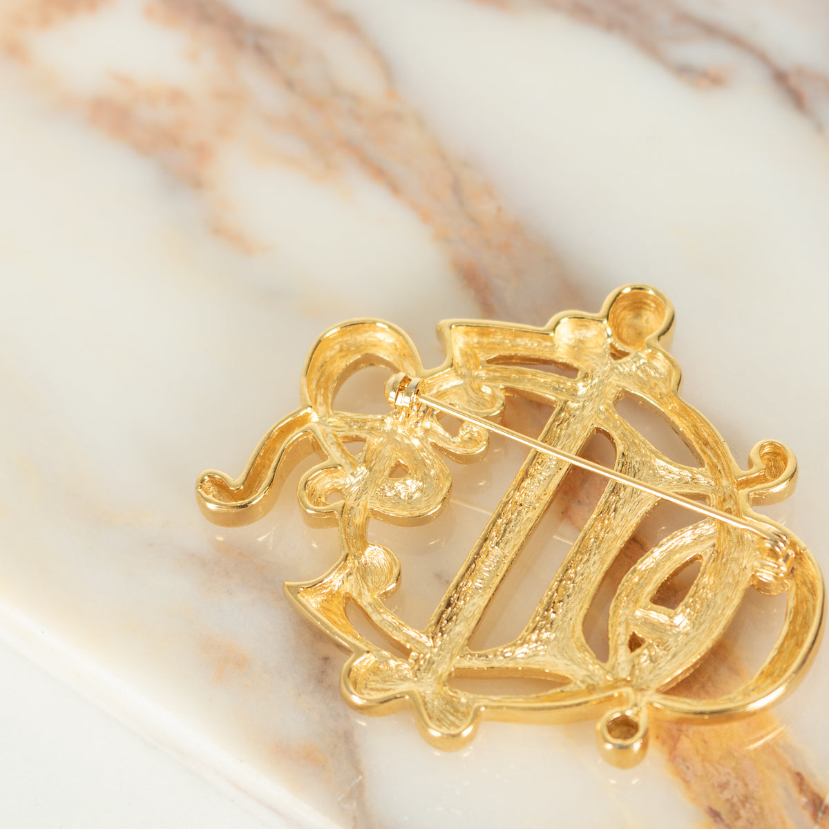 Christian Dior Gold Tone Monogram Brooch
