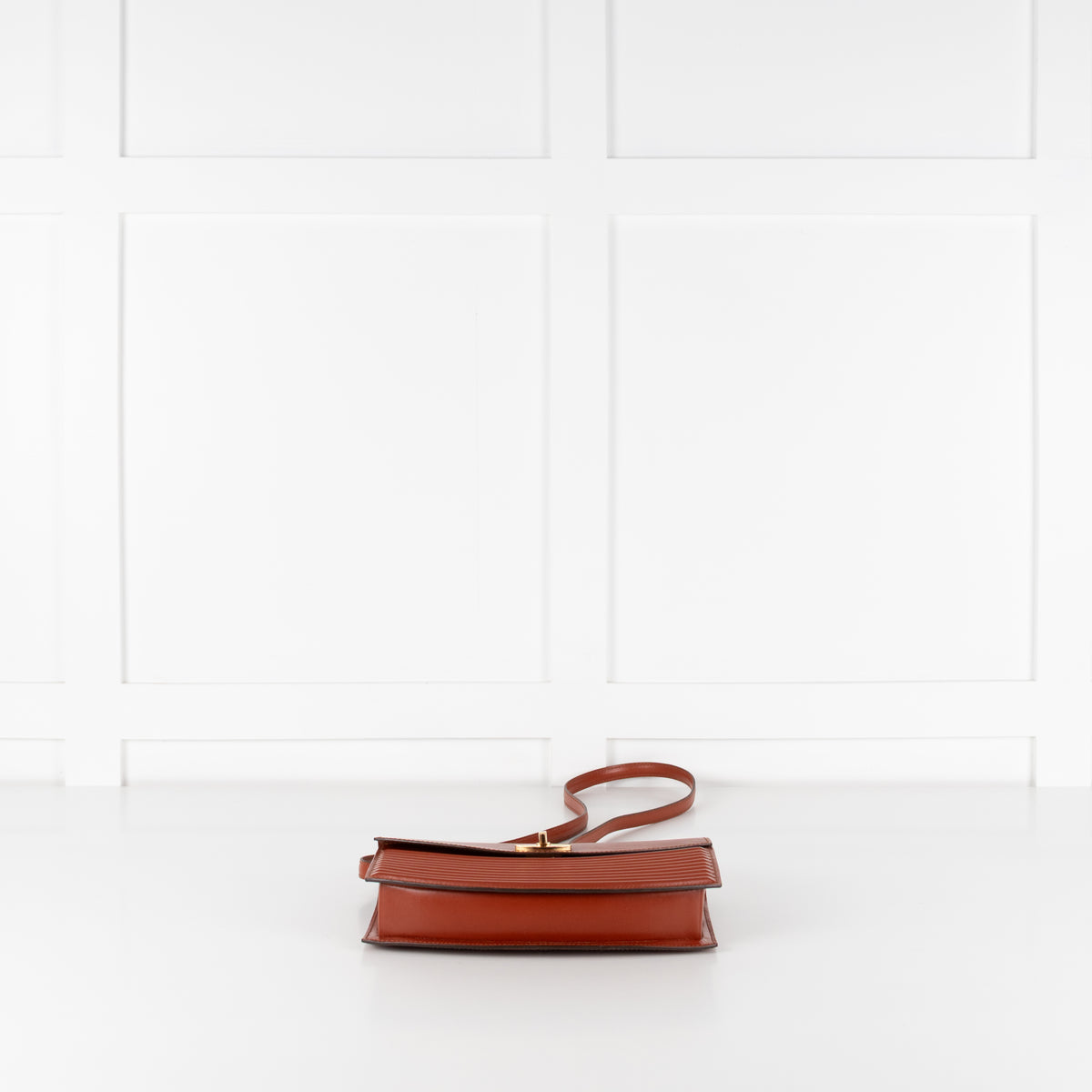 Laying down image of Louis Vuitton handbag.