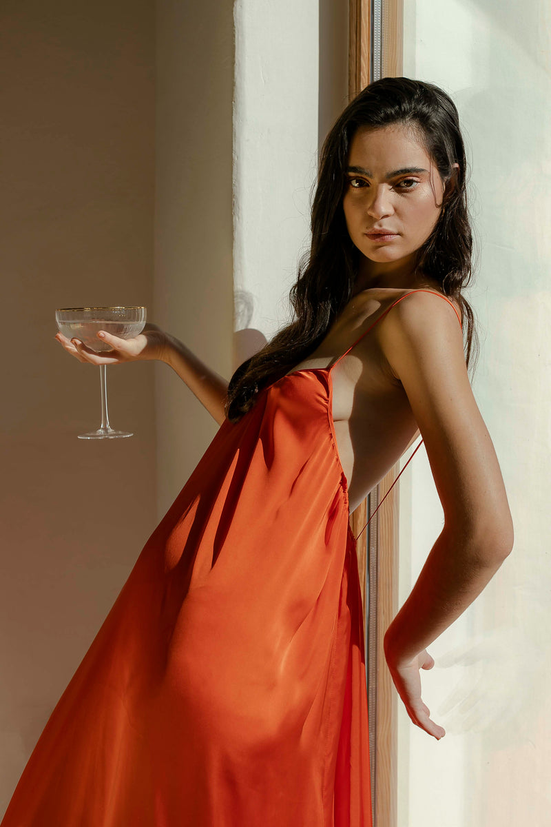 The Malama Studio Strappy Long Satin Orange Dress